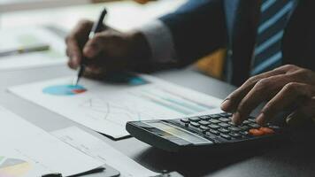 Financial Business team present. Business man hands hold documents with financial statistic stock photo, discussion, and analysis report data the charts and graphs. Finance Financial concept video