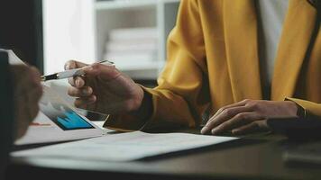 Financial Business team present. Business man hands hold documents with financial statistic stock photo, discussion, and analysis report data the charts and graphs. Finance Financial concept video