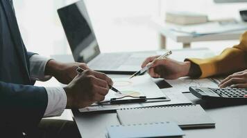 Financial Business team present. Business man hands hold documents with financial statistic stock photo, discussion, and analysis report data the charts and graphs. Finance Financial concept video