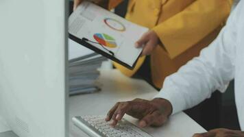 Financial Business team present. Business man hands hold documents with financial statistic stock photo, discussion, and analysis report data the charts and graphs. Finance Financial concept video