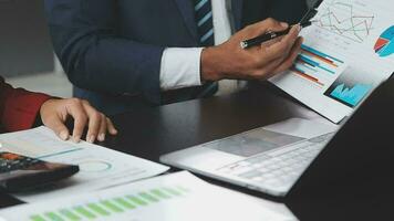 Financial Business team present. Business man hands hold documents with financial statistic stock photo, discussion, and analysis report data the charts and graphs. Finance Financial concept video