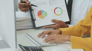 Financial Business team present. Business man hands hold documents with financial statistic stock photo, discussion, and analysis report data the charts and graphs. Finance Financial concept video
