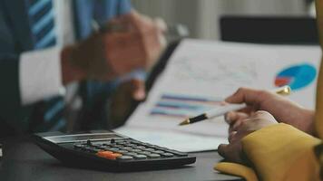 Financial Business team present. Business man hands hold documents with financial statistic stock photo, discussion, and analysis report data the charts and graphs. Finance Financial concept video