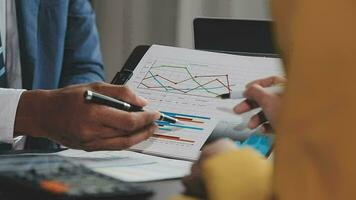 Financial Business team present. Business man hands hold documents with financial statistic stock photo, discussion, and analysis report data the charts and graphs. Finance Financial concept video