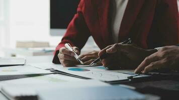 Financial Business team present. Business man hands hold documents with financial statistic stock photo, discussion, and analysis report data the charts and graphs. Finance Financial concept video