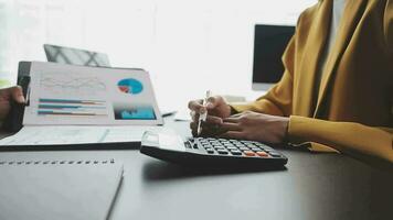 Financial Business team present. Business man hands hold documents with financial statistic stock photo, discussion, and analysis report data the charts and graphs. Finance Financial concept video