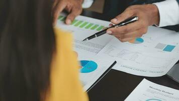 Financial Business team present. Business man hands hold documents with financial statistic stock photo, discussion, and analysis report data the charts and graphs. Finance Financial concept video