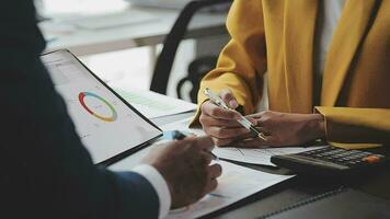 Financial Business team present. Business man hands hold documents with financial statistic stock photo, discussion, and analysis report data the charts and graphs. Finance Financial concept video