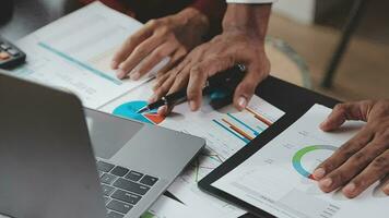 Financial Business team present. Business man hands hold documents with financial statistic stock photo, discussion, and analysis report data the charts and graphs. Finance Financial concept video
