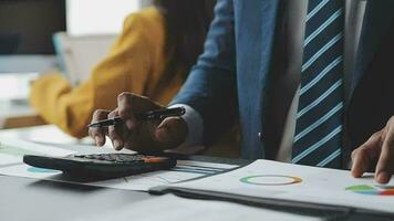 Financial Business team present. Business man hands hold documents with financial statistic stock photo, discussion, and analysis report data the charts and graphs. Finance Financial concept video