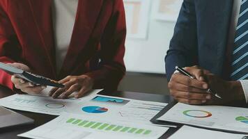 Financial Business team present. Business man hands hold documents with financial statistic stock photo, discussion, and analysis report data the charts and graphs. Finance Financial concept video