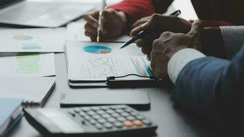 Financial Business team present. Business man hands hold documents with financial statistic stock photo, discussion, and analysis report data the charts and graphs. Finance Financial concept video