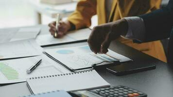 Financial Business team present. Business man hands hold documents with financial statistic stock photo, discussion, and analysis report data the charts and graphs. Finance Financial concept video