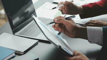 Financial Business team present. Business man hands hold documents with financial statistic stock photo, discussion, and analysis report data the charts and graphs. Finance Financial concept video