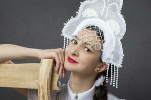 Snow Maiden. Winter portrait of a beautiful young woman in a winter crown. photo