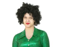 Portrait of a woman in an afro wig on a white background. Disco girl. photo