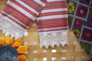 Ethnic Slavic embroidered towels Belarusian or Ukrainian on a wooden background. photo