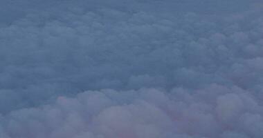 The airplane is flying above the clouds, view from the window video