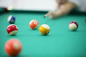 Billiard balls on a green background. Billiards game photo