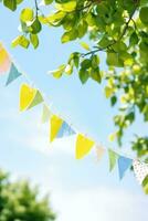 Colorful bunting at the party with trees behind it photo