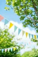 Colorful bunting at the party with trees behind it photo