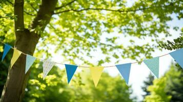 Colorful bunting at the party with trees behind it photo