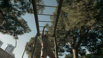 Workout on monkey bar in the park video