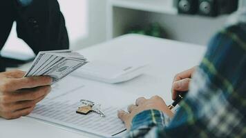 Real estate broker agent presenting and consult to customer to decision making sign insurance form agreement, buy and sell home model, concerning mortgage loan offer for and house insurance video