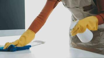 Young Woman Cleaning Computer With Rag In Office video