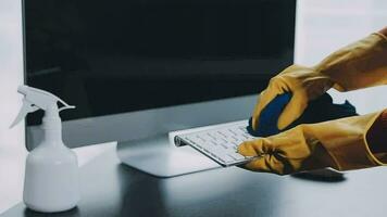 Young Woman Cleaning Computer With Rag In Office video