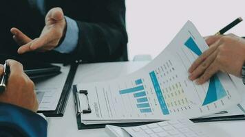 Team of business people working together in the meeting room office, teamwork background charts and graphs banner, double exposure successful teamwork,business planning concept. video