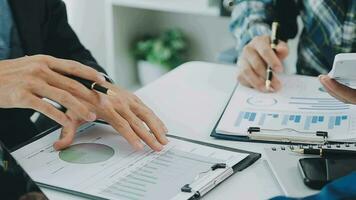 Team of business people working together in the meeting room office, teamwork background charts and graphs banner, double exposure successful teamwork,business planning concept. video