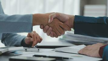 Business handshake for teamwork of business merger and acquisition,successful negotiate,hand shake,two businessman shake hand with partner to celebration partnership and business deal concept video