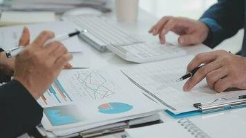 Close up of Business team analyzing income charts and graphs with modern laptop computer. Business analysis and strategy concept. video