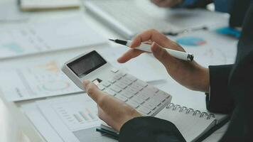 Close up of Business team analyzing income charts and graphs with modern laptop computer. Business analysis and strategy concept. video