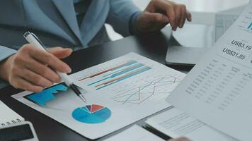 Close up of Business team analyzing income charts and graphs with modern laptop computer. Business analysis and strategy concept. video