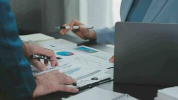 Close up of Business team analyzing income charts and graphs with modern laptop computer. Business analysis and strategy concept. video