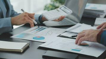 Close up of Business team analyzing income charts and graphs with modern laptop computer. Business analysis and strategy concept. video