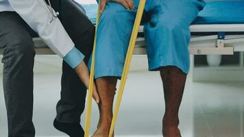 A physiotherapist doing treatment with patient in bright office video