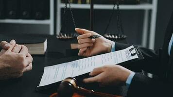 Judge gavel with Justice lawyers having team meeting at law firm background. Concepts of Law and Legal services. video