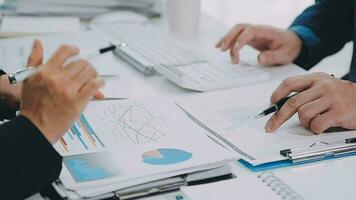 Close up of Business team analyzing income charts and graphs with modern laptop computer. Business analysis and strategy concept. video
