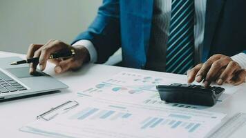 Close up of Business team analyzing income charts and graphs with modern laptop computer. Business analysis and strategy concept. video
