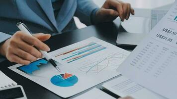 Close up of Business team analyzing income charts and graphs with modern laptop computer. Business analysis and strategy concept. video