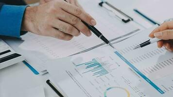 Close up of Business team analyzing income charts and graphs with modern laptop computer. Business analysis and strategy concept. video