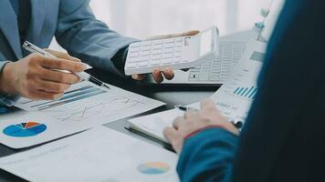 Close up of Business team analyzing income charts and graphs with modern laptop computer. Business analysis and strategy concept. video