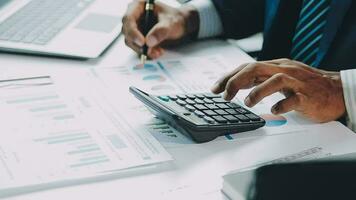 Close up of Business team analyzing income charts and graphs with modern laptop computer. Business analysis and strategy concept. video