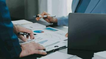 Close up of Business team analyzing income charts and graphs with modern laptop computer. Business analysis and strategy concept. video