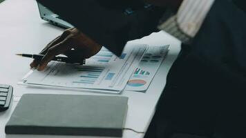 Close up of Business team analyzing income charts and graphs with modern laptop computer. Business analysis and strategy concept. video