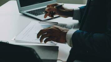 Close up of Business team analyzing income charts and graphs with modern laptop computer. Business analysis and strategy concept. video
