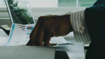 Close up of Business team analyzing income charts and graphs with modern laptop computer. Business analysis and strategy concept. video